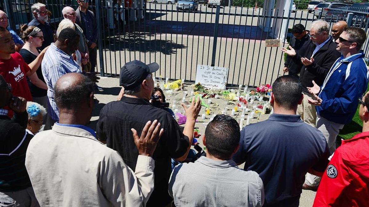 A group of church leaders from the Pastor Clusters of the Fresno/Clovis area meet outside Catholic Charities in Fresno during a prayer vigil for the victims the April 18 shooting.