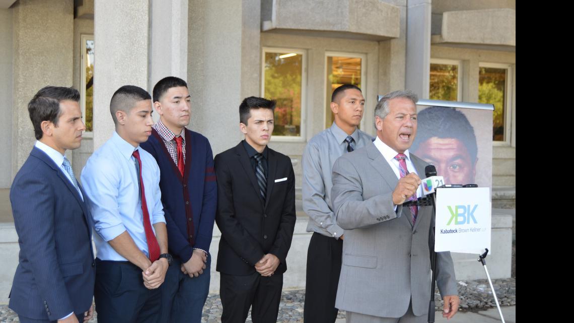
Attorney Brian Kabateck speaks at a press conference after filing five lawsuits against Monson-Sultana Joint Union Elementary School District, with plaintiffs A.V., V.V., R.V. and E.R. behind him. The lawsuits stem from the district’s employment of David Blancas, who pled guilty to sexual abuse in January 2013.
