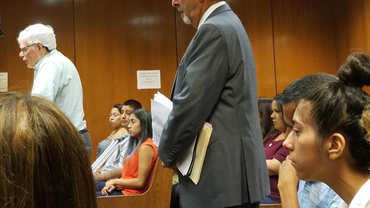 Dr. William Dominic, left, tells the judge he doesn’t believe Brianna Sandoval, far right, deserves jail time for the hit-and-run that injured him in 2016. Sandoval’s attorney, Daniel Bacon, center, said the two participated in mediation to decide Sandoval’s fate.