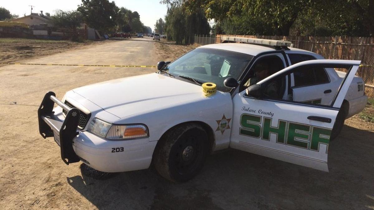 Tulare County Sheriff’s Department blocks off a road in the West Goshen neighborhood where a man was fatally shot by law officers on Wednesday, Oct. 21, 2015.