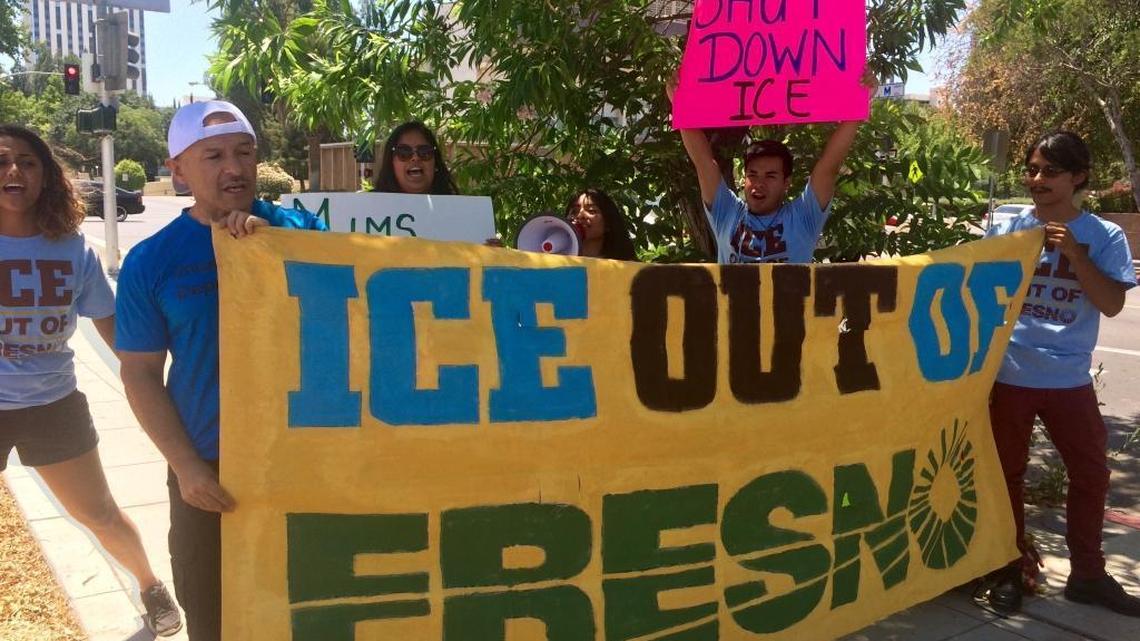 Immigrant advocates protest the collaboration between the Fresno County Sheriff’s Office and U.S. Immigration and Customs Enforcement on July 16.