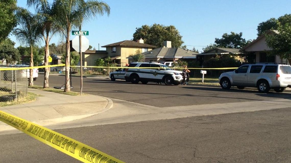 Crime tape blocks intersection at Harding and Olney avenues in Malaga, where Fresno County sheriff’s detectives were investigating a shooting by a California Highway Patrol officer.