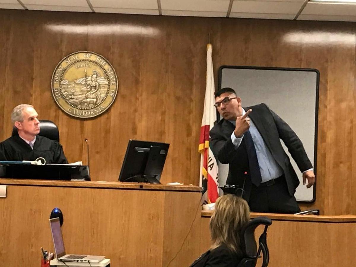 On Thursday, Feb. 1, 2018, Fresno police detective Victor Miranda demonstrated in Fresno County Superior Court to Judge Jonathan Conklin how suspected rampage killer Kori Ali Muhammad pointed his gun at a witness who saw the killing of security guard Carl Williams III at Motel 6 last April.