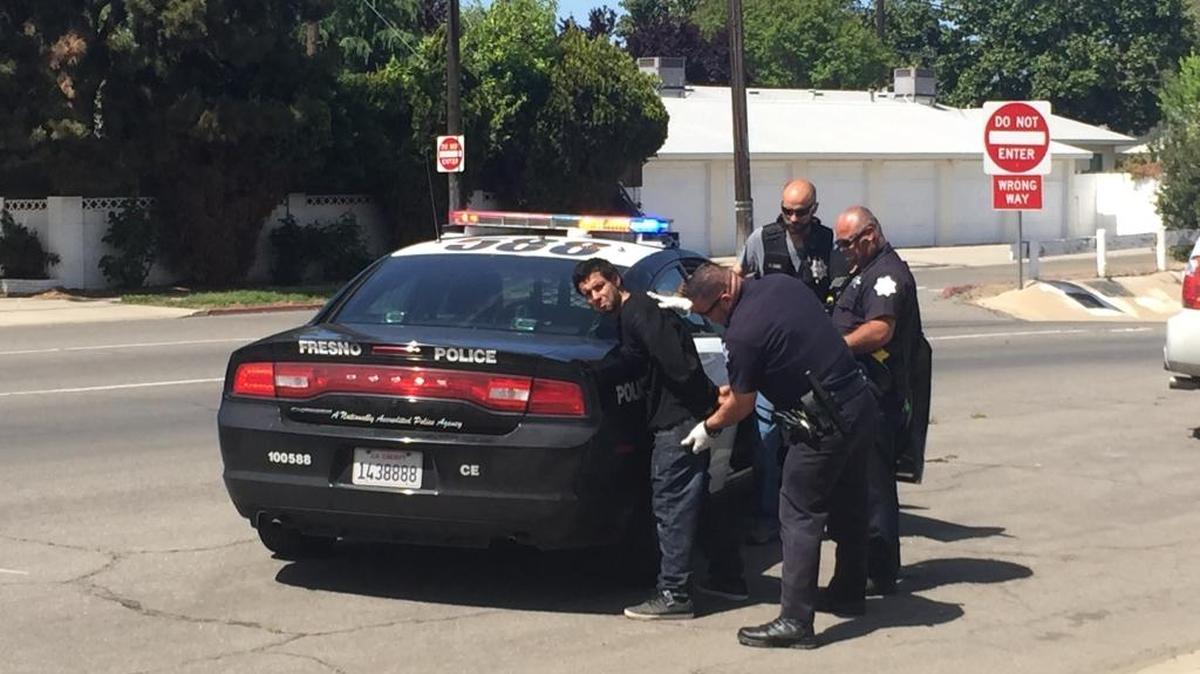 Joel Gonzalez is arrested Tuesday after trying to elude police near Shields and Maroa avenues.