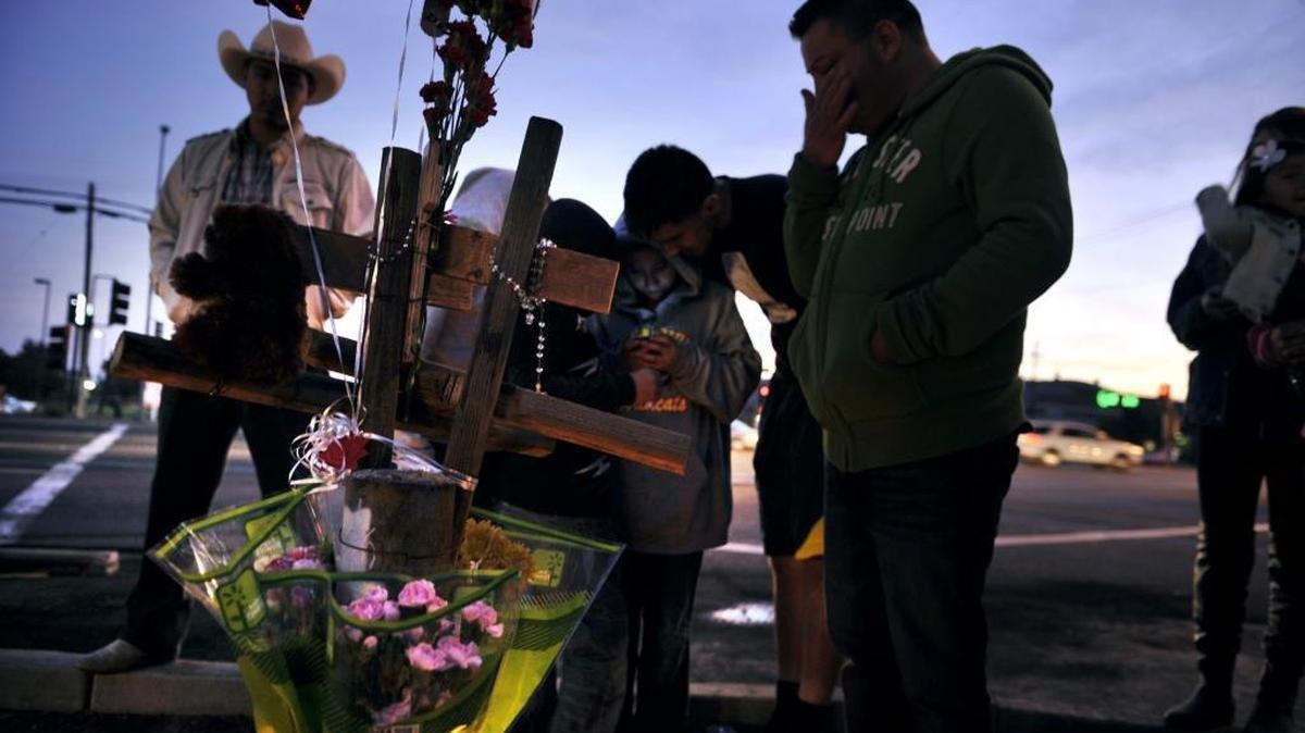 
Family gather for a rosary at the corner of Chestnut and Jensen avenues where Jacqueline Rivera and her daughter, Aaliyah Chavez, were killed in a November 2014 hit-and-run crash.
