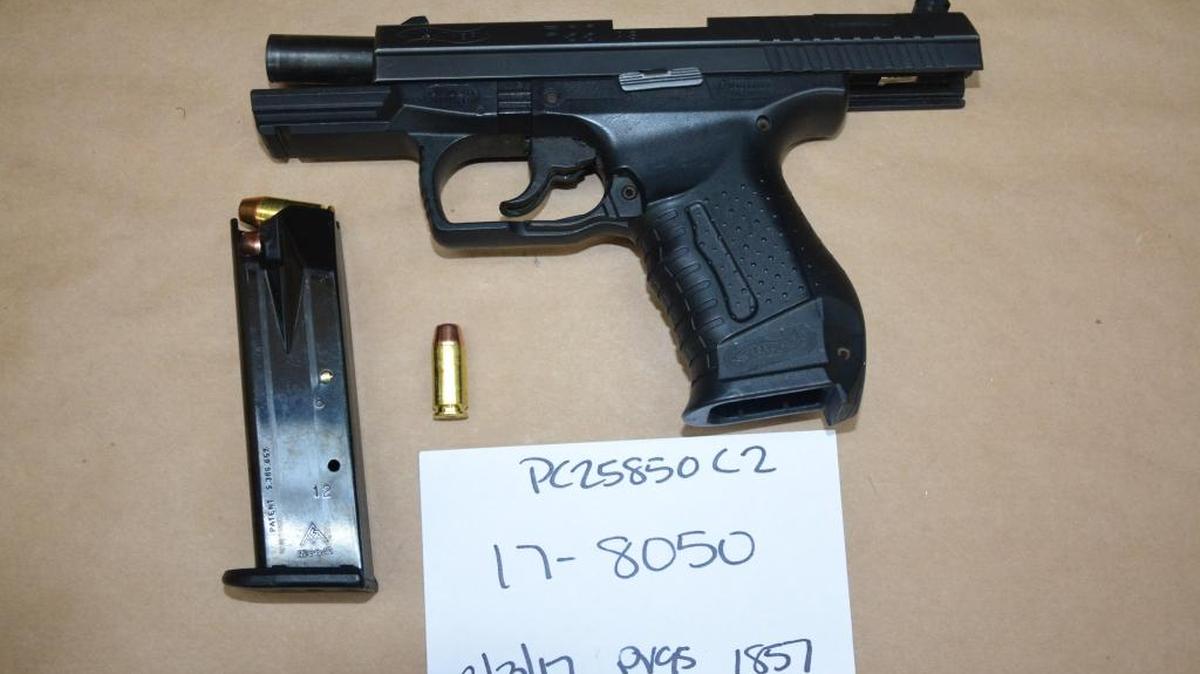 Fresno police recovered a stolen .40-caliber Walther gun from a member of the Dog Pound gang Friday after he tried running away.