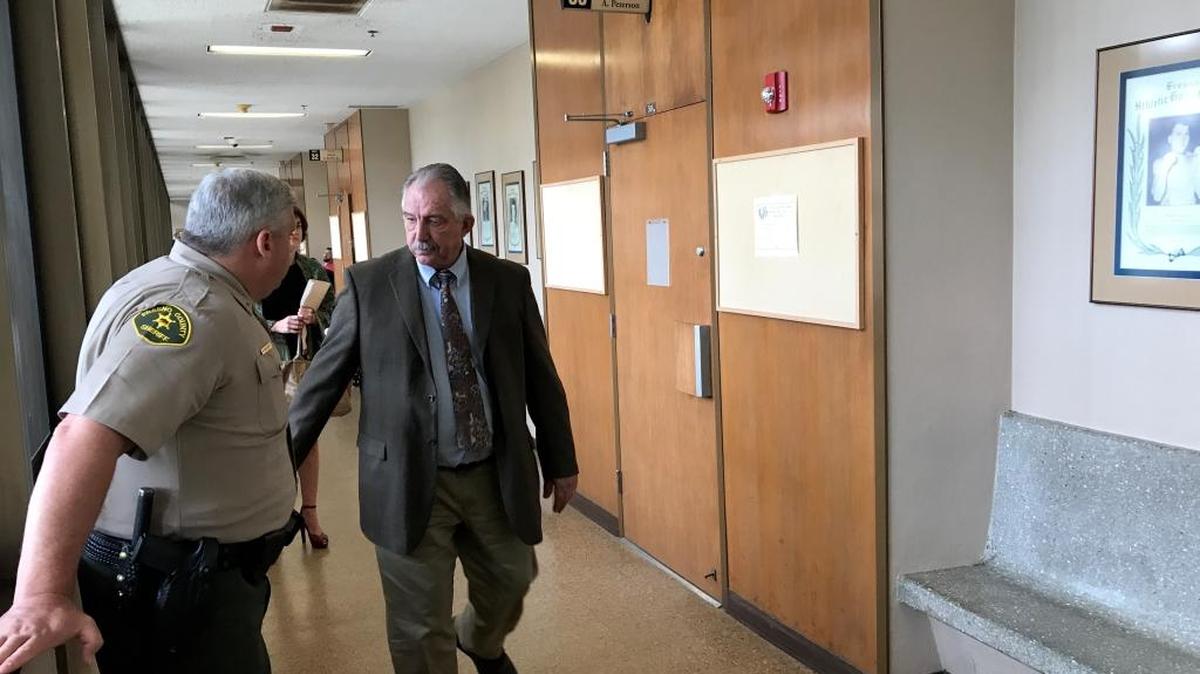Assistant Sheriff Tom Gattie, right, leaves a Fresno County courtroom on Friday, May 26, 2017, after learning that the thief who stole his guns was sent to prison for a 90-day diagnostic examination.