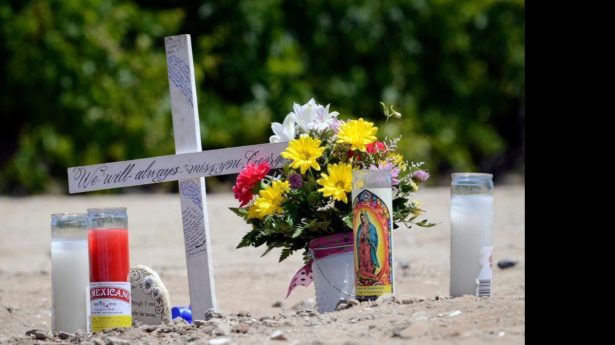 
In a May 2014 file photo, a memorial to George Salwasser Jr. is seen where he was shot and killed.
