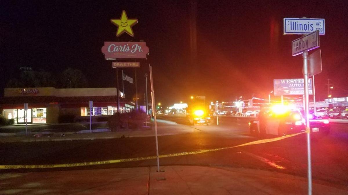 Police at the scene of a fatal stabbing near the Carl’s Jr. on Abby Street in central Fresno.