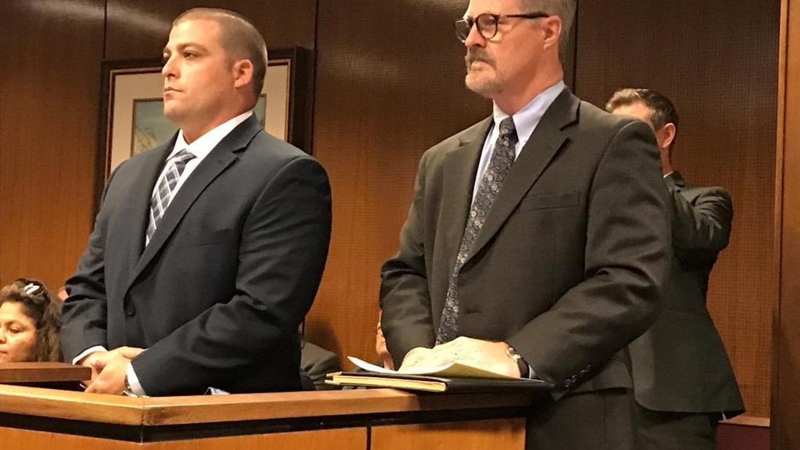 Fresno County Sheriff’s deputy Jared Mullis, left, stands next to his lawyer, Roger Wilson, during Mullis’ August arraignment in Fresno County Superior Court. Mullis pleaded not guilty to a charge with manslaughter in the shooting death of sheriff’s Sgt. Rod Lucas in October 2016.