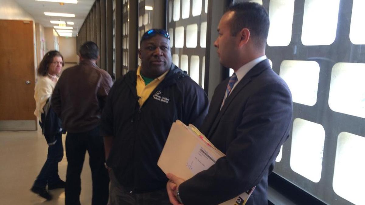 Fresno Unified employee Charlie Roberts thanks deputy district attorney Andrew Janz for prosecuting Timothy Alan Ray, who shouted a racial slur at Roberts and threatened him with a sword and military survival knife in the Tower District in October 2014.