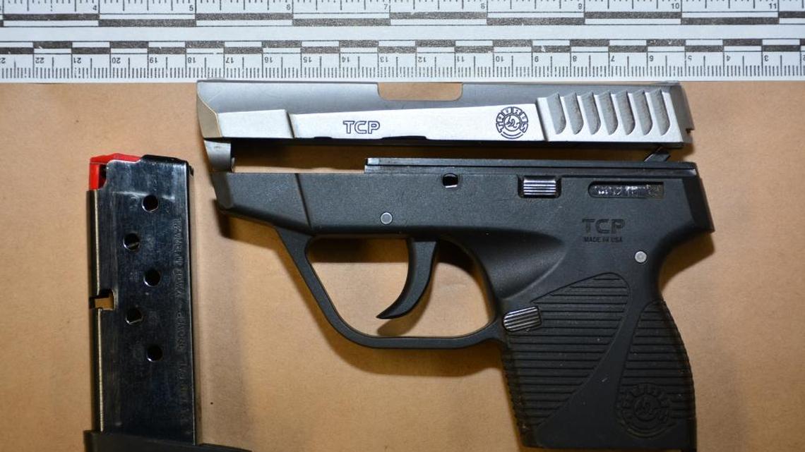 A compact semi-automatic handgun and clip were recovered at the scene of a postal van carjacking on Friday.