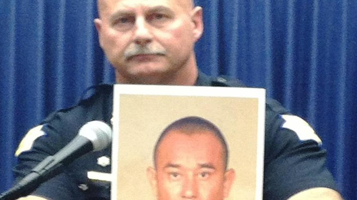 Fresno police Chief Jerry Dyer holds up a booking mug shot of Carlos Ramirez, 35, of Sanger during a Nov. 14, 2013 news conference to announce Ramirez’s arrest on rape charges.