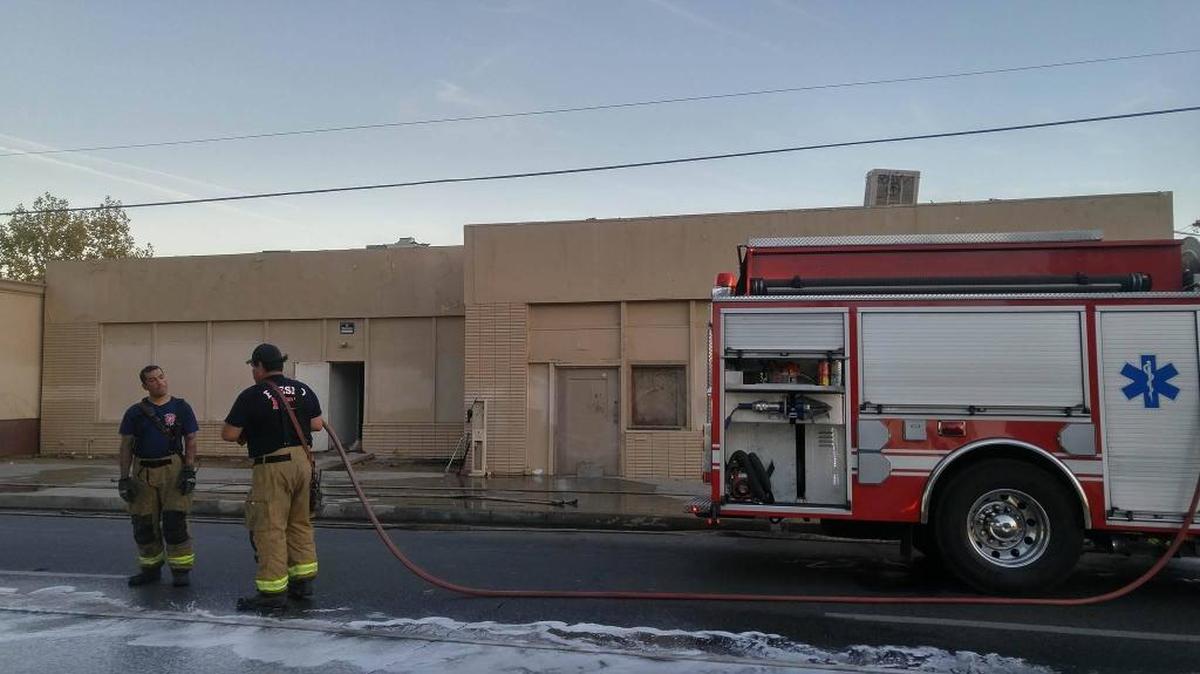 The Fresno Fire Department is quick to respond to a vacant commercial building fire on Fresno and A streets in southwest Fresno on Oct. 25, 2016.