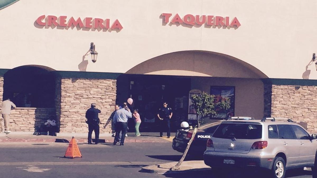 Fresno police investigate a reported shooting involving a robber and a security guard at a Vallarta Supermarket at Dakota and Cedar avenues in central Fresno Wednesday, March 23, 2016.