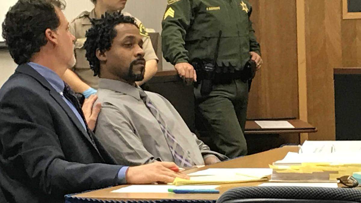 In this January 2018 photograph, accused rampage killer Kori Ali Muhammad, seated right, sat silently next to his attorney, Richard Beshwate Jr., during a hearing in Fresno Superior Court. Many of Muhammad's hearings have been interrupted by him saying that black people need reparations or natural disasters will plague America.
