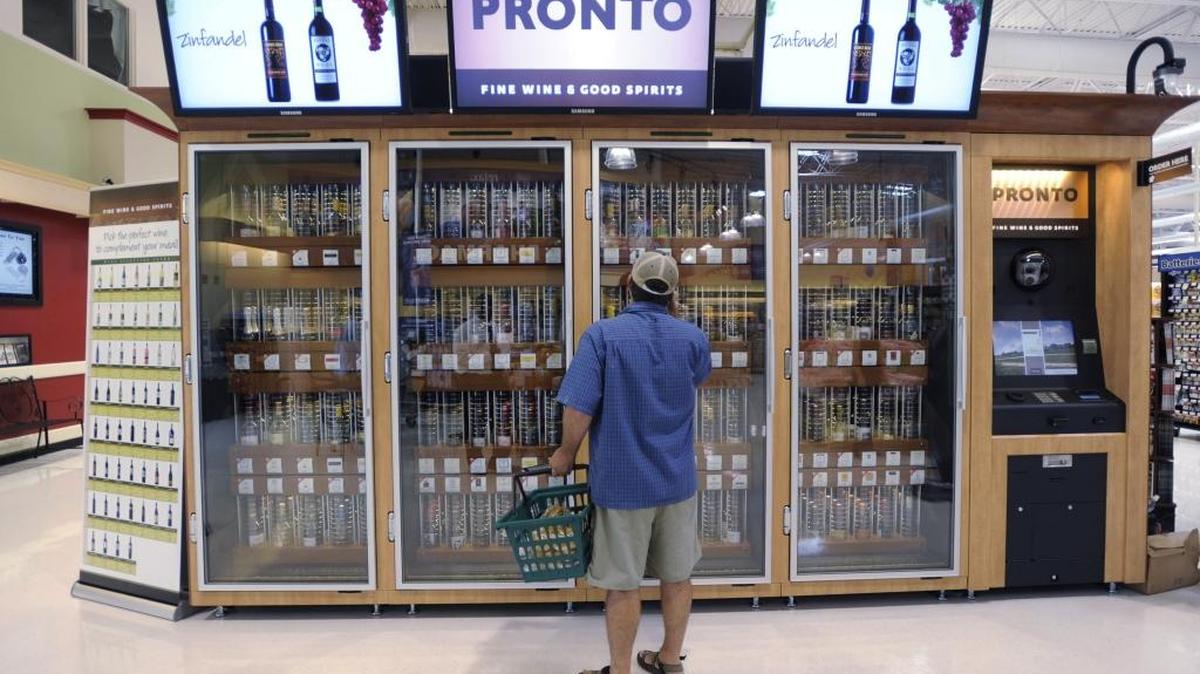 A shopper inspects the wine offerings from the Pennsylvania Liquor Control Board's self-serve wine kiosk at a Giant food store, in Harrisburg, Pa. on June 25, 2010. On Jan. 23, Visalia police conducted an operation to target alcohol consumption in public, off-sales sites.