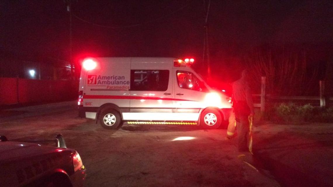 An American Ambulance vehicle drives a gunshot victim away from the scene of a shooting in southwest Fresno on Sunday.