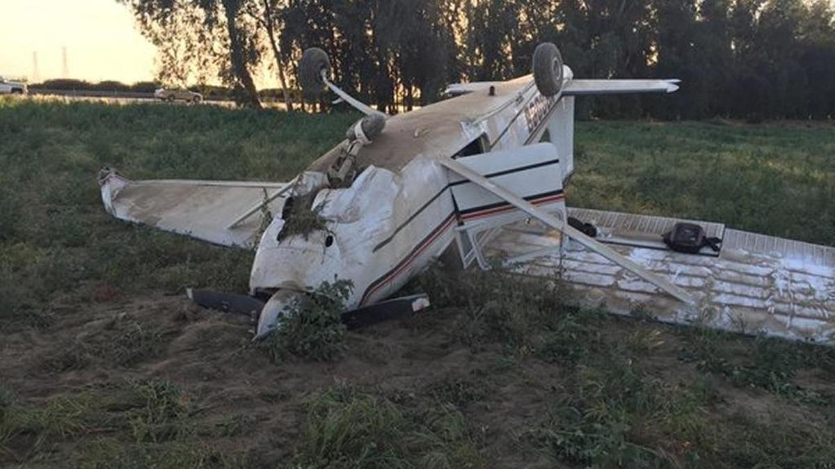 A two-passenger plane crashed and flipped upside down after landing in a field off Highway 99, near Manning and De Wolf avenues Monday evening, the Fresno County Sheriff’s Office said.