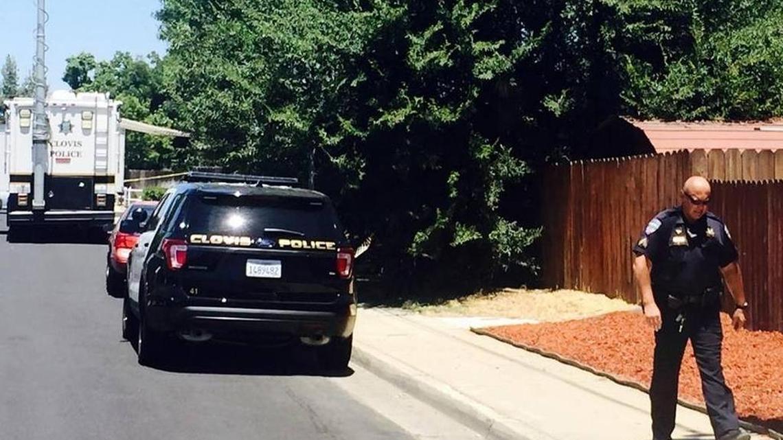 Clovis police gather near the scene of a reported police shooting near Cole Elementary School on Thursday, July 7, 2016.