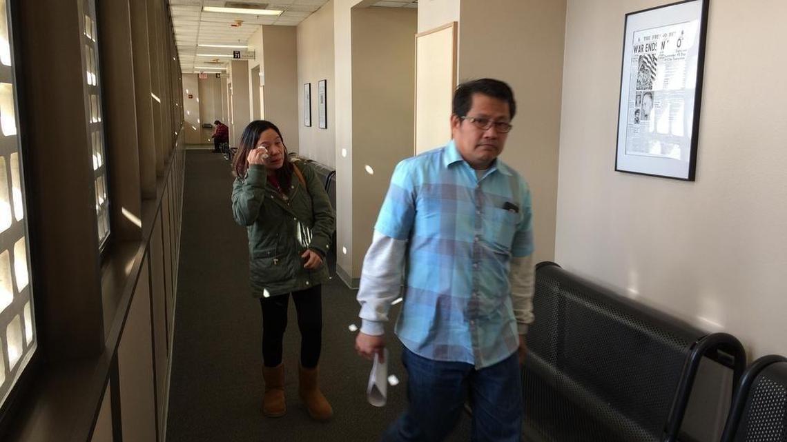 Benjamin Wong, 54, leaves a Fresno courtroom. On Friday he was found not guilty of misdemeanor charges of touching students inappropriately. In the background is his wife, Abigail.
