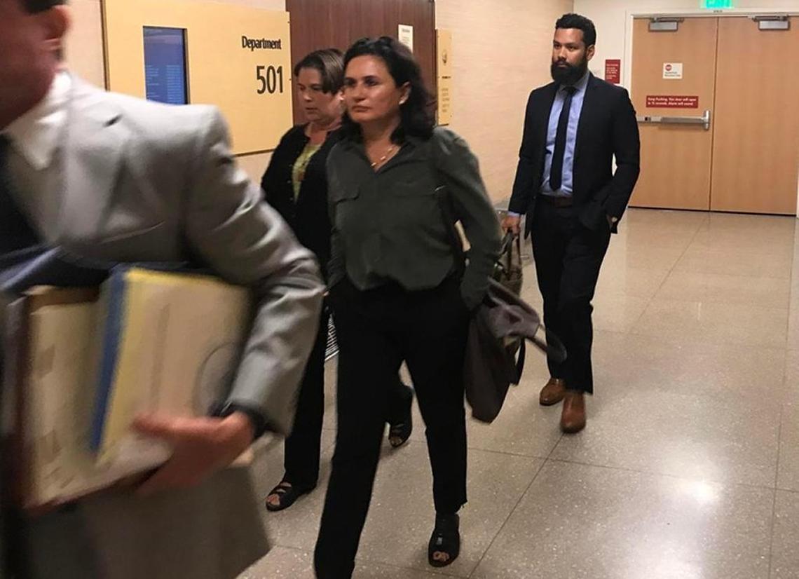Fresno cosmetic surgeon Dr. Enraquita Lopez, center, leaves the courtroom Wednesday, July 19, 2017, after a former patient accused the doctor of wrongdoing in publishing identifiable photographs of the patient’s bare breasts in her company’s promotional photo gallery.