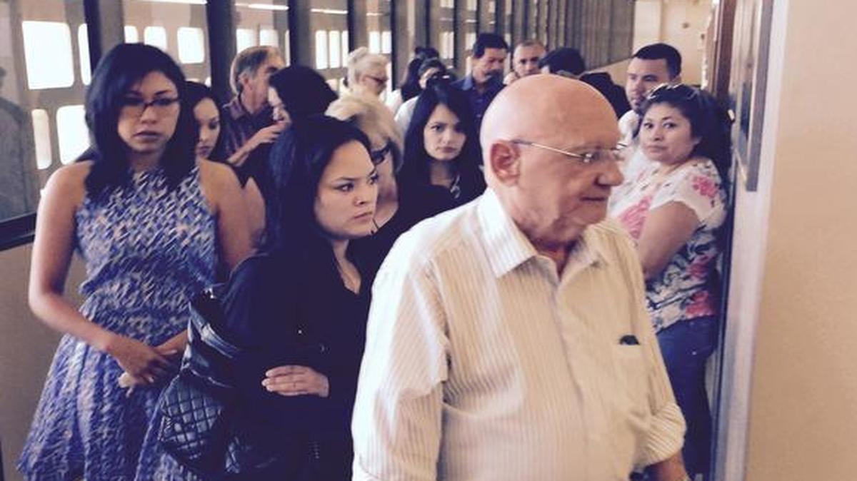 
Jacqueline Benavides Wills, in blue dress, leaves a Fresno courtroom Friday, Aug. 14, with supporters after a judge rules there is probable cause to believe she is guilty of first-degree murder in the stabbing death of Army National Guard soldier Brian Santos.
