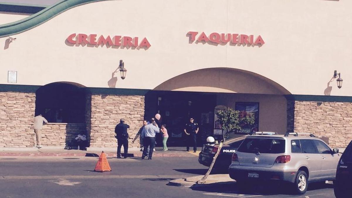 Fresno police investigate a reported shooting involving a robber and a security guard at a Vallarta Supermarket at Dakota and Cedar avenues in central Fresno Wednesday, March 23, 2016.