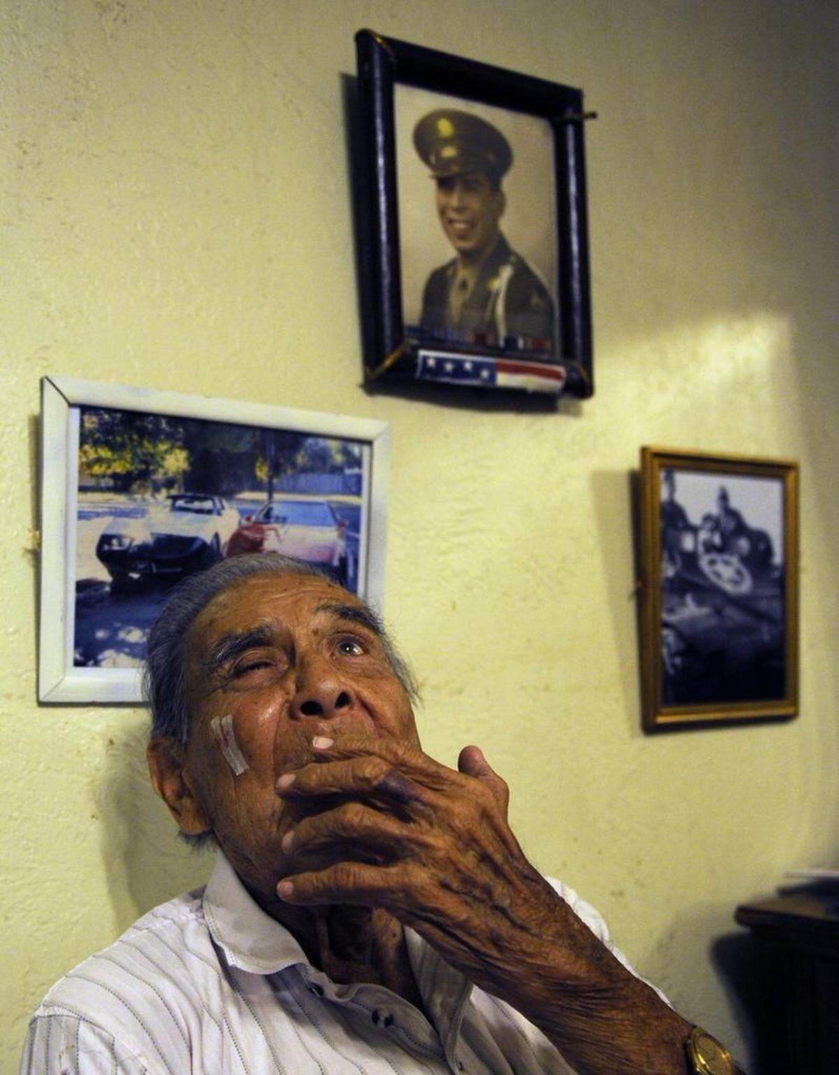 Josef Martin, 92, sits in his room days after he was beaten by three boys in a home-invasion robbery in October 2013 in Fresno, CA. "They stuck a gun in my mouth and said I had to do what they said," the World War II veteran said as he gestured to an injury on his cheek. Martin died in January 2018, more than four years after his harrowing ordeal.