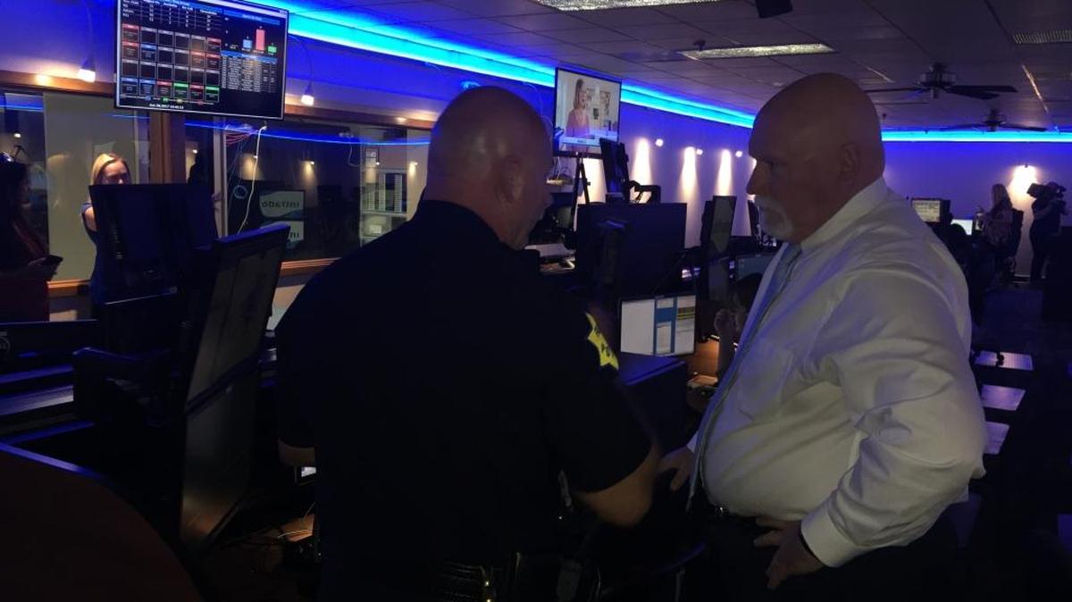 Fresno Police Chief Jerry Dyer, left, explains features of the department’s new 911 Center to city of Fresno spokesman Mark Standriff.