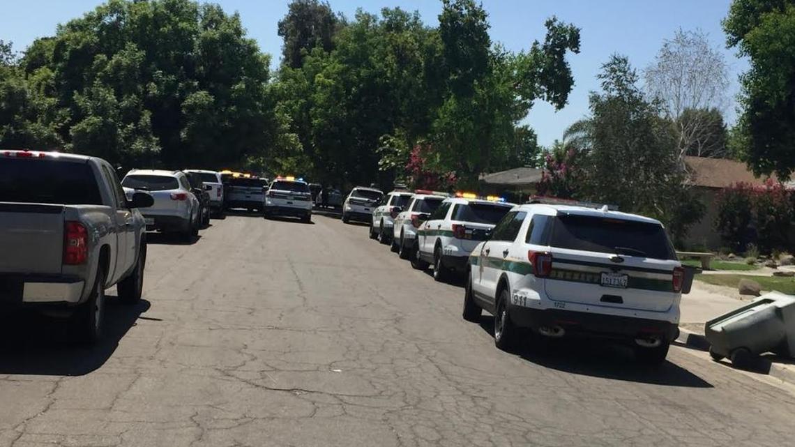 About a dozen Fresno County Sheriff’s vehicles converged on a home in the Fig Garden area Friday following the pursuit of a stolen car.