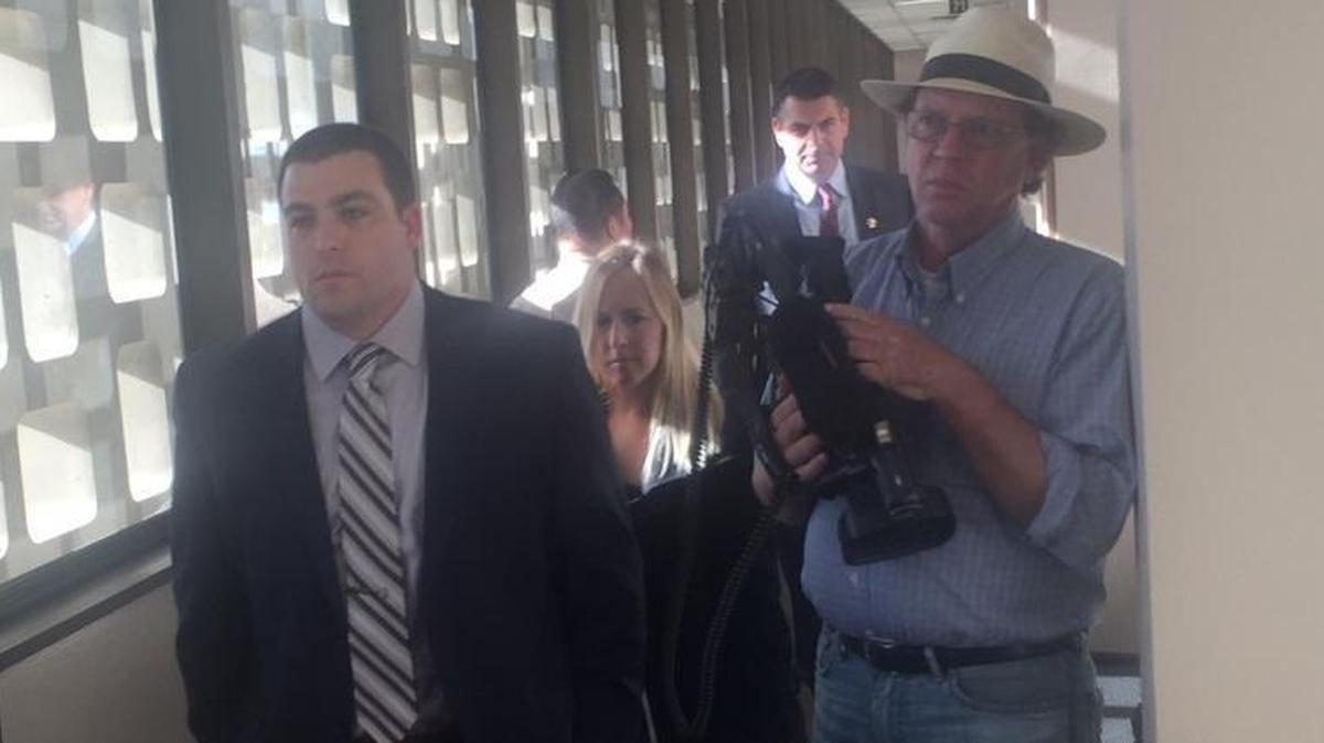 Fresno County sheriff’s Deputy Jared Mullis walks out of a Fresno County courtroom Thursday after hearing he’ll face trial for involuntary manslaughter in the shooting death of Sgt. Rod Lucas.