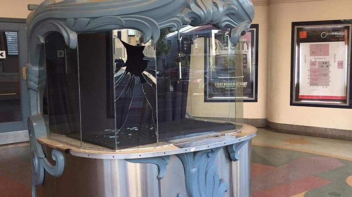 The window of the historic ticket office of the Wilson Theater used by Cornerstone Church was smashed in by a vandal.