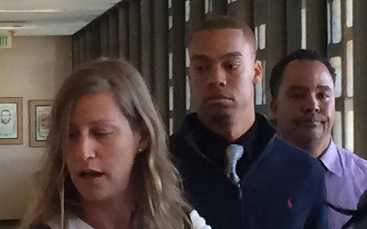 Former Fresno State student Christian Malik Pryor, 19, center, enters the courtroom for his sentencing hearing for making a criminal threat on social media in November that caused students to leave the campus and classes to be canceled. On Friday, a judge ordered him to be taken into custody and sent to prison for a evaluation that could take up to 90 days. At left is is his lawyer, Sharon Applebaum, with his father at right.