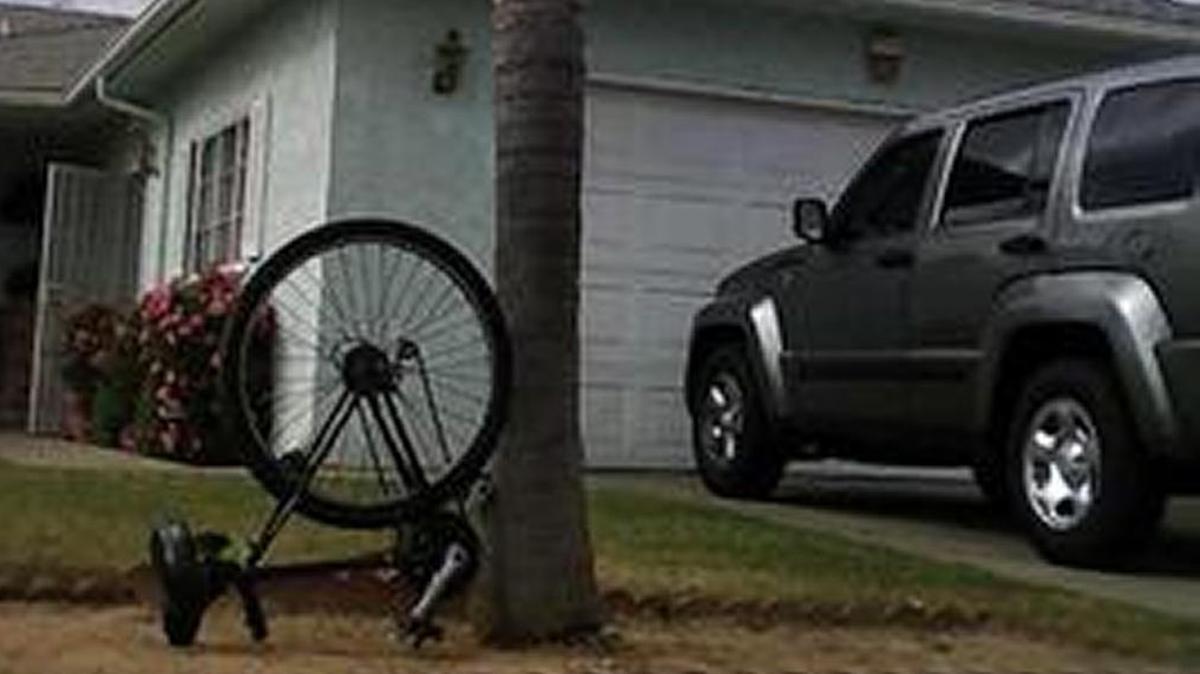 A burglar got his bike sawed in half after being caught snooping in car windows