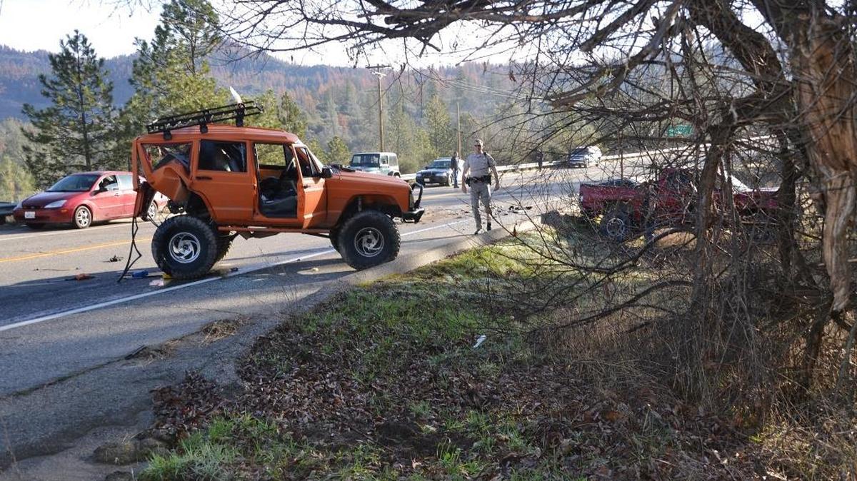 A Jeep involved in a three-car collision rests in the road near North Fork.