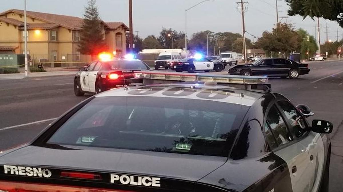 
Fresno police investigate a car-to-car shooting in southwest Fresno Monday that resulted in a crash. No one was struck by gunfire but a woman was injured the crash, police said.
