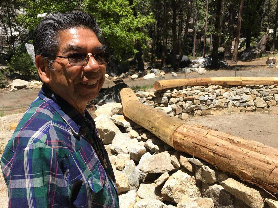 Les James, chairman of the Wahhoga Committee, beside a roundhouse under construction at the Wahhoga village site in Yosemite Valley on June 1, 2018.