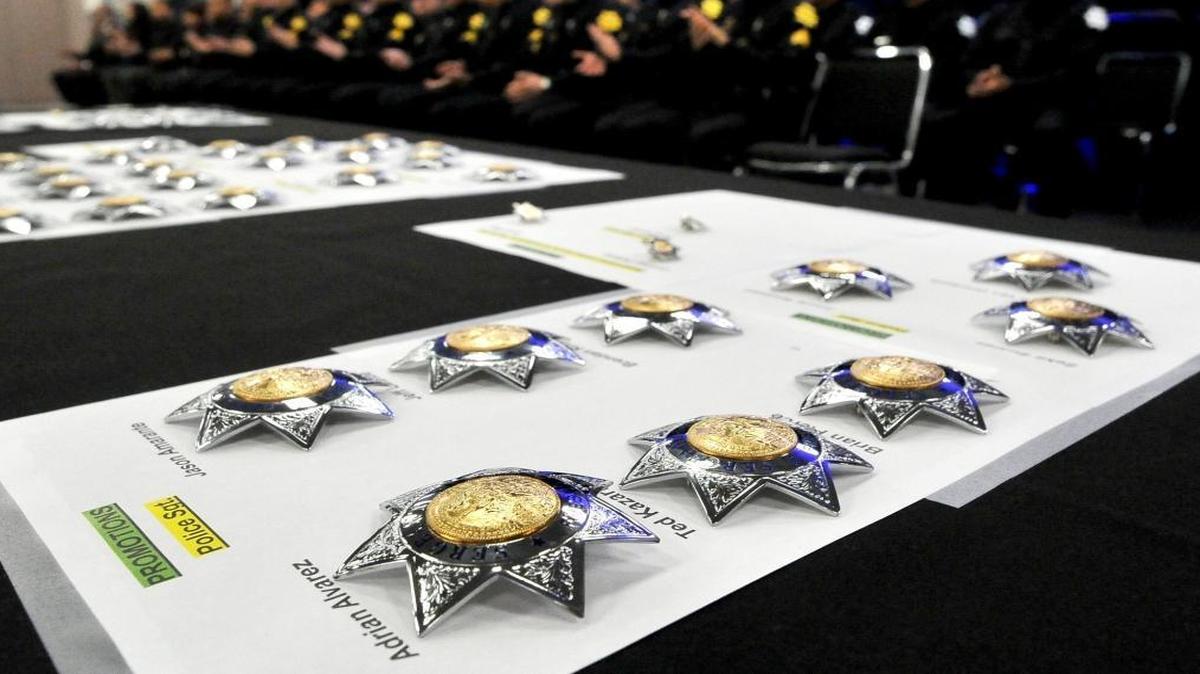 Badges lined up for the Fresno Police Department Swearing In and Promotional Ceremony Tuesday, Jan. 10, 2017, at the Fresno Convention Center.