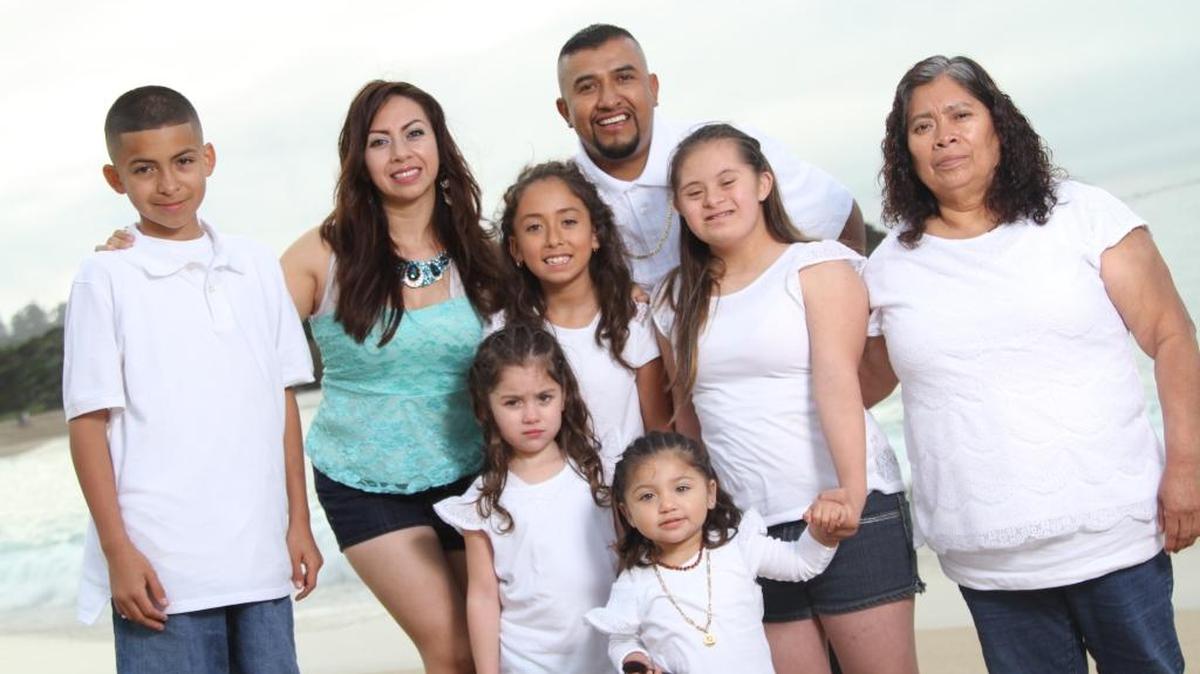 Reya Castellanos and José Luis Rodriguez, pose for a family photo with their five children, along with the kids’ grandmother, Cris Castellanos. Reya Castellanos, who is a DACA recipient, says she has purchased land in Mexico, fearful that President Donald Trump will revoke her protection from deportation.