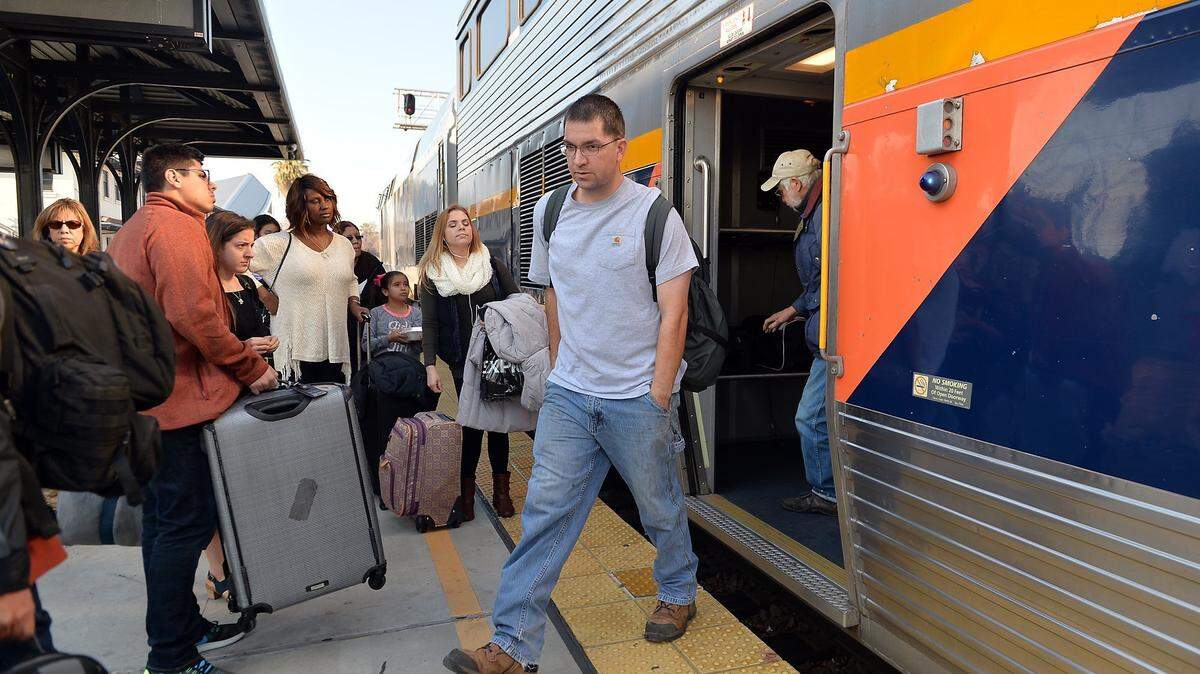 Train passengers wait to board an Amtrak San Joaquin train at downtown Fresno’s Amtrak station in this file photo. Amtrak service through the San Joaquin Valley to Stockton, Sacramento, Oakland and Bakersfield could be disrupted starting Thursday, Sept. 15, 2022, by a possible work stoppage affecting the freight railroads on whose tracks the Amtrak trains run.