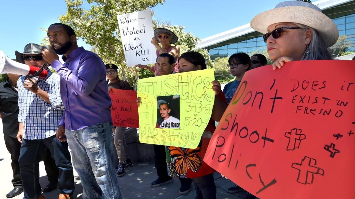 Marcus Winston calls for unity and healing in light of recent police shootings during a rally in front of Fresno City Hall on Monday that was attended by several people whose family members had been shot by Fresno police.