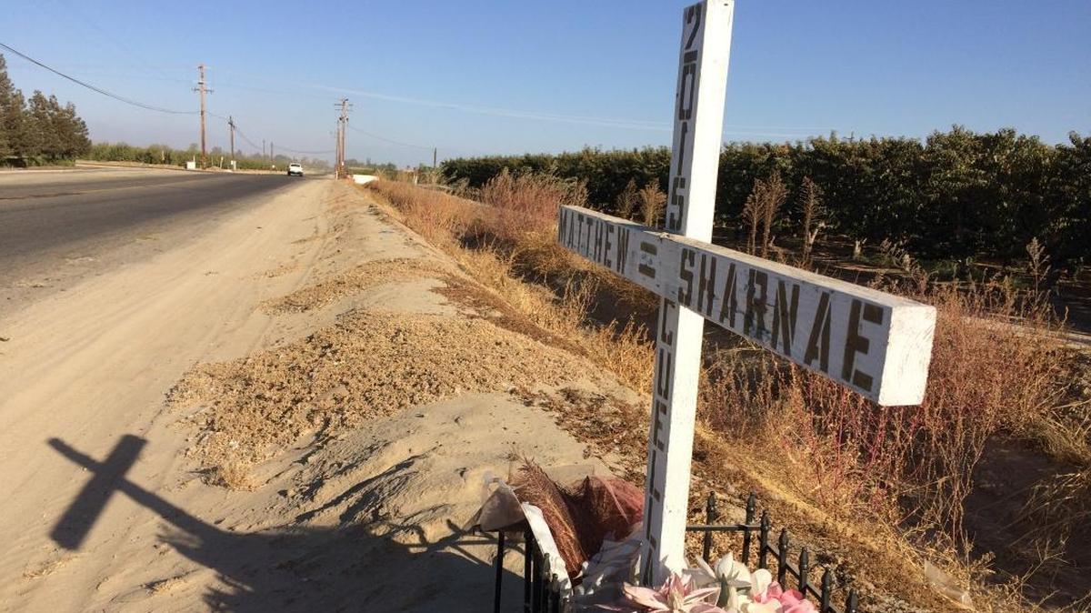 A white cross stands where Matthew Cuellar, 26, and his 24-year-old wife, Sharnae Cuellar, were killed Dec. 17, 2015, in a head-on collision with a suspected drunken driver. The collision near the intersection of Clarkson and Bethel avenues near Kingsburg left the Cuellars’ three children, ages 6, 4, and 2, without parents. The children are now in a legal custody battle that involves an American Indian tribe.