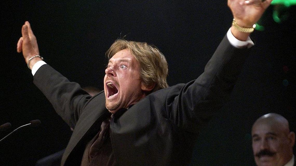 
Wrestler “Rowdy” Roddy Piper gestures to the crowd after being inducted into the WWE Hall of Fame at the Induction Ceremony in Universal City in April 2005. Piper died Friday, July 31. He was 61.
