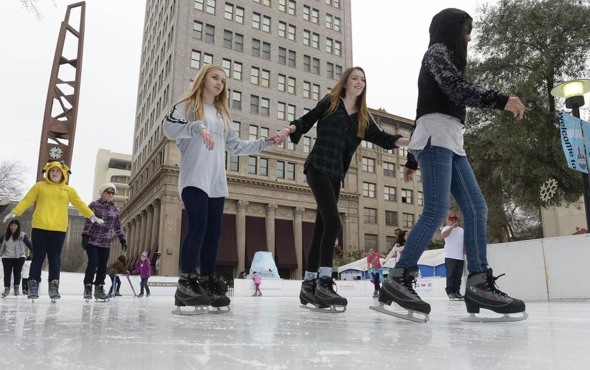 Left to right, Hope Grant, 14, Sydney Yell, 16, and Tiffany Beavers, 11, skate at the downtown Fresno Ice Rink in 2017.
