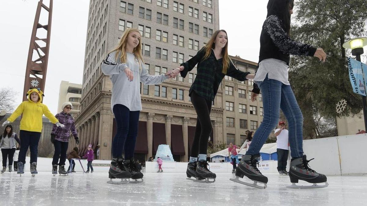 Left to right, Hope Grant, 14, Sydney Yell, 16, and Tiffany Beavers, 11, skate at the downtown Fresno Ice Rink on the last weekend the rink was open.