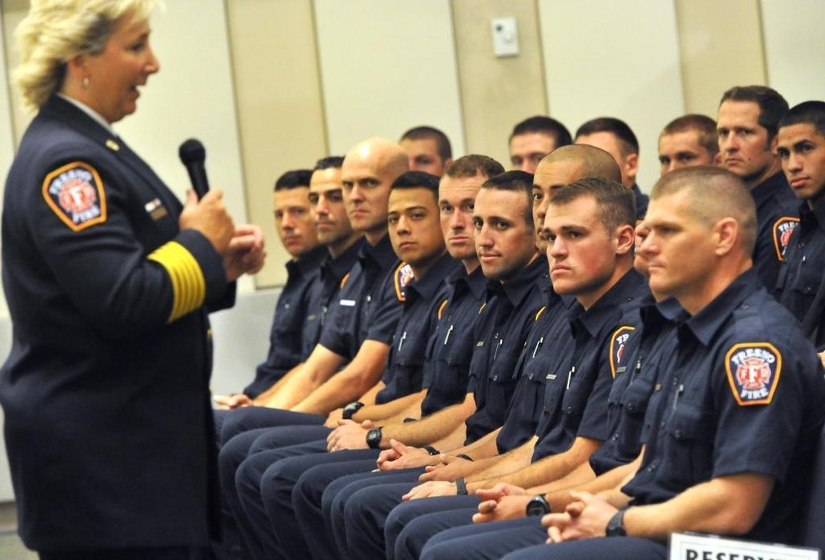 A 2016 class of Fresno Fire Department probationary firefighters listen to Fire Chief Kerri Donis during the Promotional Ceremony and Academy Graduation at City Hall.