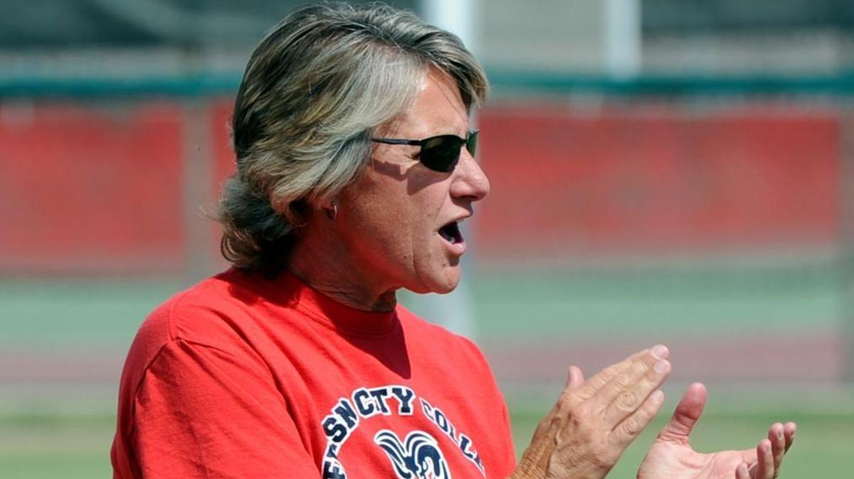 Fresno City College softball coach Rhonda Williams cheers for her team during practice in this 2013 photograph. She is one of three women coaches suing State Center Community College District for gender discrimination.