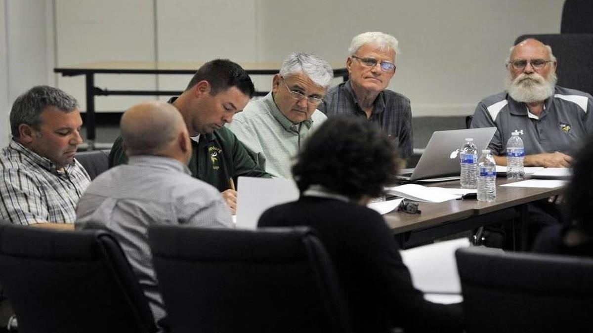 Kingsburg Joint Union High School District trustees approve a policy that allows teachers to carry guns on campus at a meeting in April 2016.