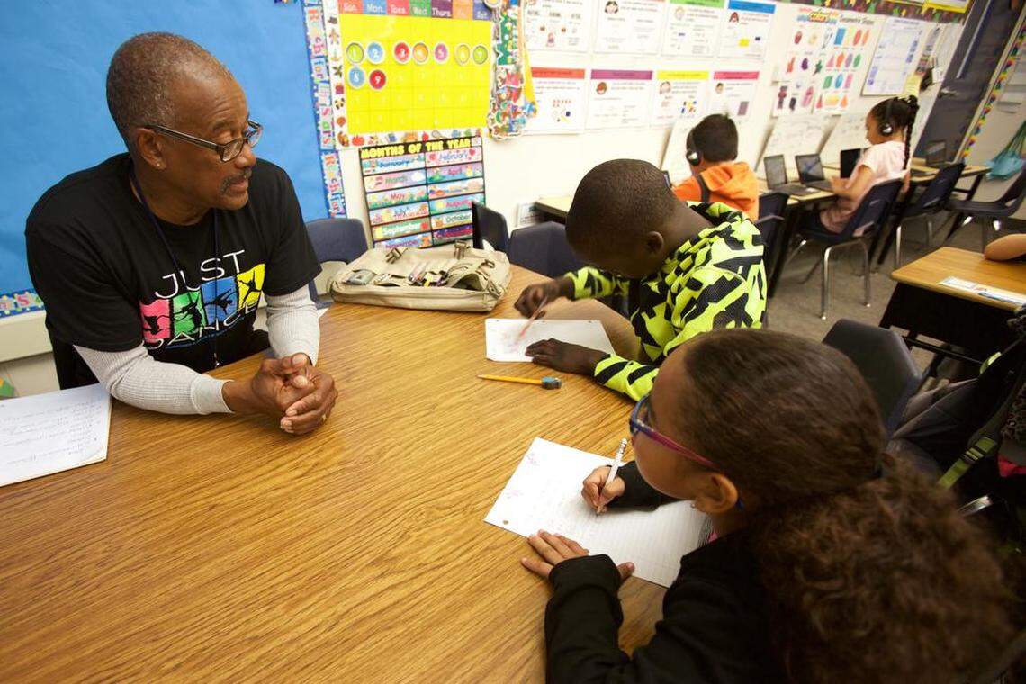 Stanley Jones gives a reading quiz to students at King Elementary during a Hands On Central California tutoring session.